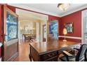 Office with hardwood floors and antique doors looking into dining area at 4115 Gold Mill Rdg, Canton, GA 30114