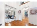 Open foyer view into the dining room with hardwood floors and natural light at 4429 Windsor Oaks Cir, Marietta, GA 30066