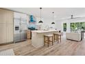 Modern kitchen with stainless steel appliances, an island with barstool seating, and lots of sunlight at 4745 Elam Forest Dr, Stone Mountain, GA 30083