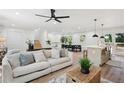 Bright and airy living room featuring a modern ceiling fan and open-concept design at 4745 Elam Forest Dr, Stone Mountain, GA 30083