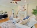 Inviting living room featuring hardwood floors, fireplace, and stylish neutral-toned furnishings at 2437 N Decatur Rd, Decatur, GA 30033