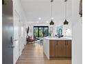 Open-concept kitchen and living area with modern decor and plenty of natural light at 112 Rogers Street Ne # 410, Atlanta, GA 30317