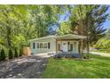 A well-maintained home features a charming exterior, lush lawn, and a welcoming entrance at 2572 Bates Se St, Smyrna, GA 30080
