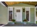 Close up of the front of the home, showing front door with small plants on either side at 2572 Bates Se St, Smyrna, GA 30080