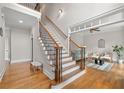 Grand foyer with hardwood floors, staircase with iron spindles, and open view to living area at 3519 Preserve Se Dr, Atlanta, GA 30339