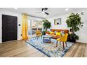 Bright living room with large window, contemporary furnishings, and stylish decor at 7994 Devonshire Dr, Jonesboro, GA 30238