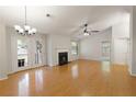 Bright living room boasts hardwood floors, a fireplace, and French doors for easy access to the outside at 1450 Keys Crossing Ne Dr, Brookhaven, GA 30319