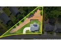 A top-down view showing property lines, the home's roof, the driveway, and surrounding neighborhood at 200 Cherokee Reserve Cir, Canton, GA 30115