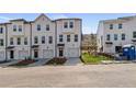 New construction townhomes feature private garages, modern design, and well-maintained landscaping at 3136 Washburn Se St, Atlanta, GA 30354
