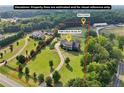 Expansive acreage showcasing the home, barn, and surrounding landscape, perfect for equestrian enthusiasts at 3480 Indian Shoals Rd, Dacula, GA 30019