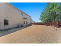Large backyard with a well-kept lawn, a privacy fence, and mature trees at 403 Sonja Ln, Loganville, GA 30052
