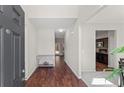 Welcoming entryway with hardwood floors and neutral paint colors, leading to the kitchen and dining area at 403 Sonja Ln, Loganville, GA 30052
