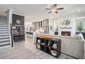 Open-concept living area showcases an inviting layout with a modern fireplace and seamless kitchen access at 710 Elmwood Way, Roswell, GA 30075