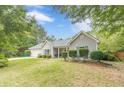 Lovely single-story home with manicured landscaping, a two-car garage, and a charming front entrance at 123 Chippewa Run, Auburn, GA 30011