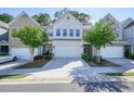 Inviting townhome with a well-maintained front yard and a two-car garage at 128 Madison Bnd, Woodstock, GA 30188