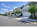 Charming townhome community with beautiful landscaping and ample parking at 128 Madison Bnd, Woodstock, GA 30188