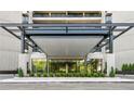 Inviting building entrance with modern architecture and manicured landscaping at 2660 Peachtree Rd # 6A, Atlanta, GA 30305