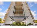 Exterior view of a high-rise building showcasing its modern architecture and balconies at 2660 Peachtree Rd # 6A, Atlanta, GA 30305