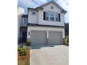 Charming two-story home featuring a two-car garage and inviting curb appeal at 3848 Hester St, Duluth, GA 30097