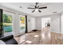 Bright living room featuring hardwood floors, large windows and neutral wall paint at 4289 Post Rd, Winston, GA 30187