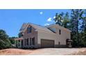 The home features a side entry garage, traditional architectural style, and a well-maintained landscape at 8239 High Lake Ter, Covington, GA 30014