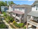 Exterior shot showcasing townhomes with covered patios, fenced yards, and attractive landscaping at 914 Martin Nw St, Atlanta, GA 30315