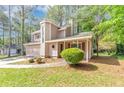Inviting two-story home with well-kept lawn, integrated garage, and a covered front porch at 916 Forest Pointe Way, Jonesboro, GA 30238