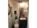Efficient half bath including vanity and mirror at 3503 Ten Oaks Court Ct, Powder Springs, GA 30127