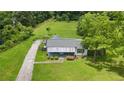 A home with a welcoming porch and classic charm awaits at 3517 Plunkett Rd, Stonecrest, GA 30038