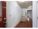 Inviting foyer with hardwood floors and stairs, creating a warm and welcoming entry to the home at 1071 N Village Dr, Decatur, GA 30032