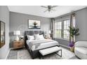 Cozy bedroom with a comfortable bed, soft lighting, and a large window at 199 14Th Ne St # 402, Atlanta, GA 30309