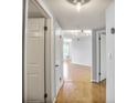 Hallway with hardwood floors leading to a naturally lit living space at 199 14Th Ne St # 402, Atlanta, GA 30309