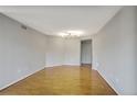 Open living room featuring hardwood flooring and ample space at 199 14Th Ne St # 402, Atlanta, GA 30309