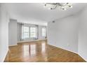 Inviting living room with plenty of natural light from multiple windows and hardwood flooring at 199 14Th Ne St # 402, Atlanta, GA 30309