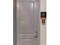 Neutral-colored door of guest suite 202 with modern hardware and signage at 3338 Peachtree Ne Rd # 508, Atlanta, GA 30326