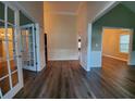 Spacious entryway featuring new wood flooring and stylish millwork at 3878 Hannahberry Pl, Buford, GA 30519