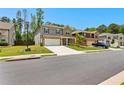 Residential street showcasing a well-maintained home with a spacious driveway and beautifully landscaped front yard at 510 Cunninghame Ct, Peachtree City, GA 30269