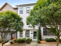 Attractive two-story home with white brick, mature trees, and well-maintained landscaping at 752 Winton Way, Atlanta, GA 30312