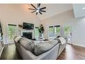 Bright living room featuring a vaulted ceiling, fireplace, and large windows at 3005 Park Chase, Alpharetta, GA 30022