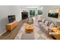 Inviting living room featuring a stone fireplace and neutral decor at 3008 Pine Tree Trl # 16D, Atlanta, GA 30349