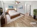 Serene main bedroom with warm wood floors and plenty of natural light at 3008 Pine Tree Trl # 16D, Atlanta, GA 30349
