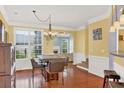 Bright dining room with hardwood floors, and direct sightlines to the living room with fireplace at 2685 Sardis Chase Ct, Buford, GA 30519