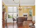 Bright dining room with hardwood floors, and direct sightlines to the living room with fireplace at 2685 Sardis Chase Ct, Buford, GA 30519