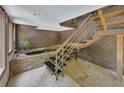 Unique interior featuring an indoor fish pond, creating a serene and eye-catching focal point under staircase at 4655 Latimer Ne Ct, Kennesaw, GA 30144