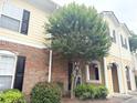 Beautiful townhouse with well-maintained landscaping, brick and siding and black shutters at 602 Summer Pl, Norcross, GA 30071