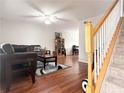 Comfortable living room with hardwood floors and staircase leading to the upper level at 602 Summer Pl, Norcross, GA 30071