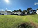 Lovely home with a well-maintained lawn, fenced yard, and inviting curb appeal at 929 Wexford Way, Auburn, GA 30011