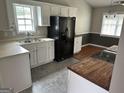 Kitchen with ample countertop space, modern appliances and stylish finishes at 929 Wexford Way, Auburn, GA 30011