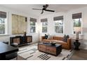 Bright living room features stylish furnishings, decorative accents, and large windows showcasing natural light at 1598 Driggs Nw Dr # 163, Atlanta, GA 30318