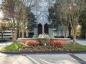 Apartment building entrance featuring lush landscaping and water fountain at 2870 Pharr Court South Nw # 1405, Atlanta, GA 30305